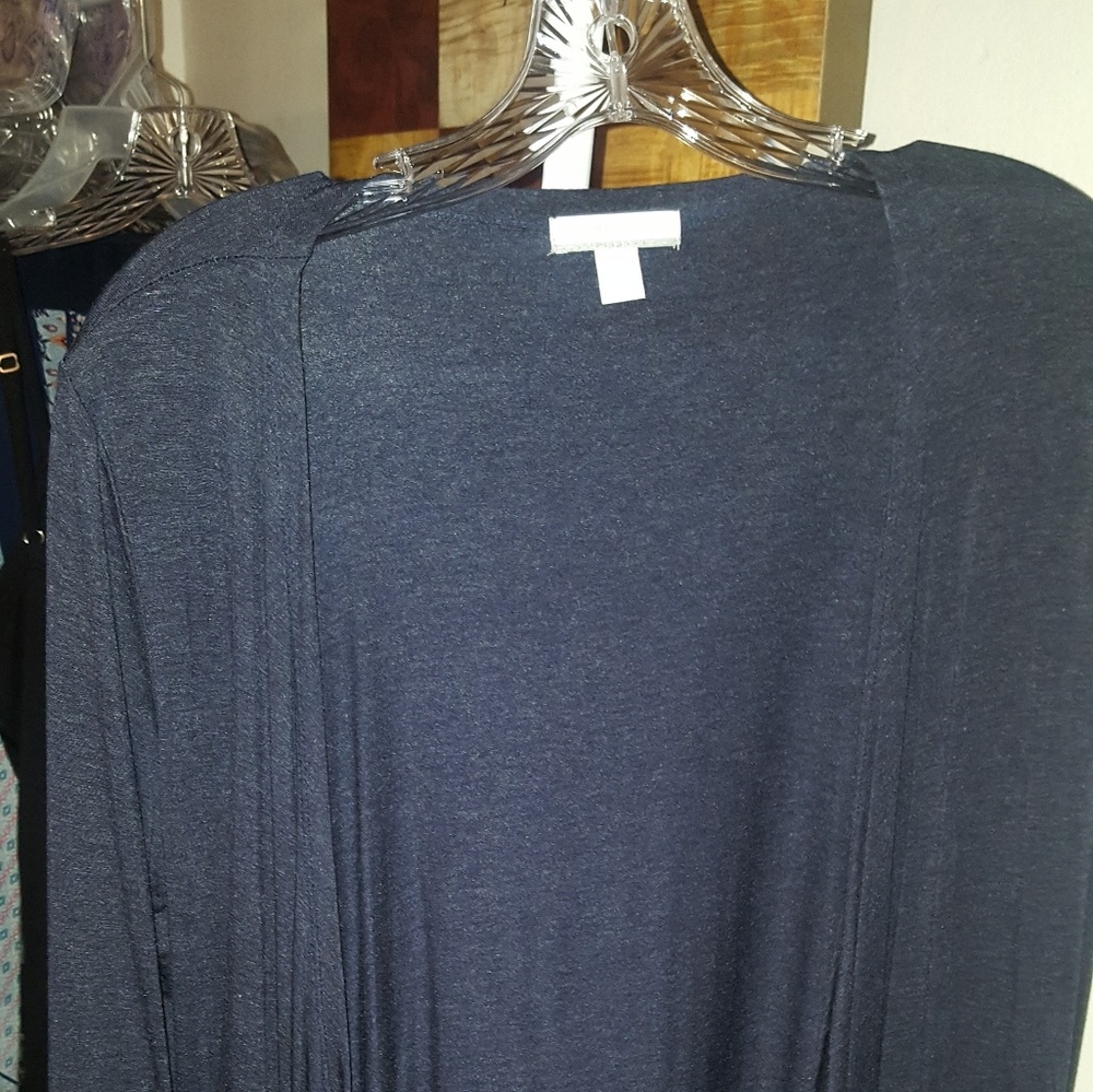 Beautiful blue over throw. Rippled bottom / sleeve